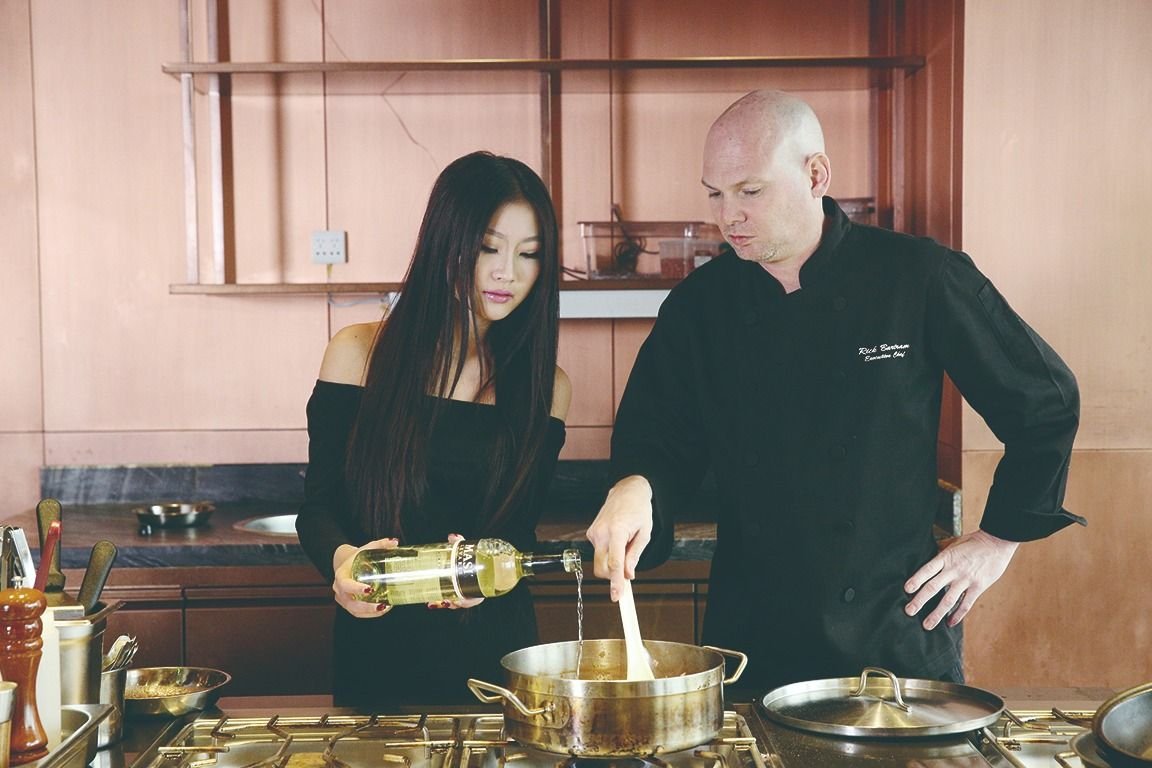 Rick Bartram cooking cioppino for Boss Style Magazine
