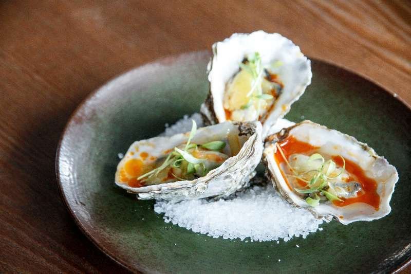Baked oysters with smoked paprika and Manchego