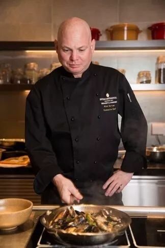 Rick Bartram cooking at the stove
